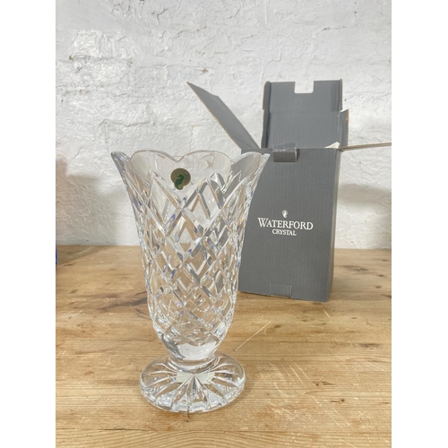 31 - Three pieces of boxed glassware comprising Tiffany & Co. Dartington Crystal pitcher, Waterford Cryst... 