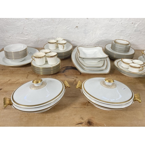 34 - An approx. seventy eight piece Hutschenreuther Selb ceramic dinner service to include two lidded tur... 