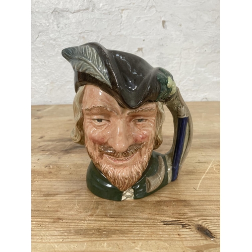 41 - Four Royal Doulton character jugs comprising George Washington, Robin Hood, The Star Crossed Lovers ... 