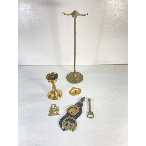 63 - A collection of assorted brassware to include two Middle Eastern style decanters, five piece fire co... 