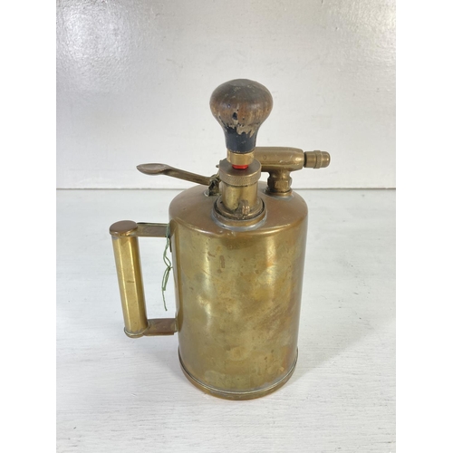 64 - Three pieces of vintage copper and brassware comprising Burmos Regency no. 1 paraffin blow torch, pr... 