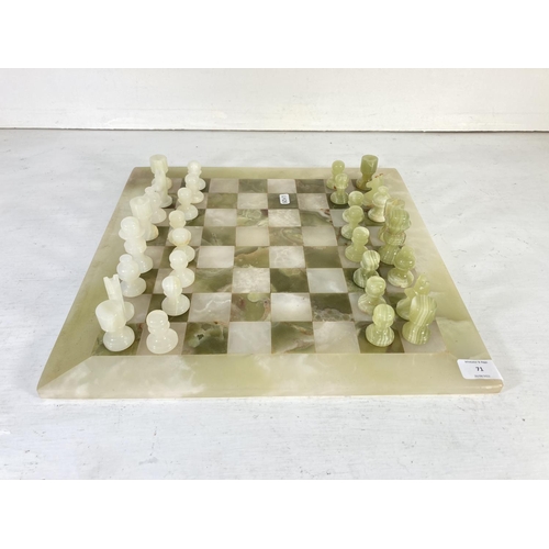 71 - An onyx thirty two piece chess set - board approx. 40.5cm²