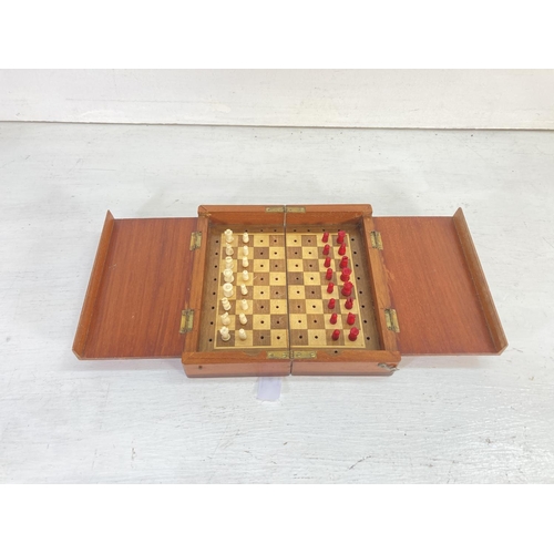 76 - A mid 20th century Jaques of London hardwood cased portable chess set