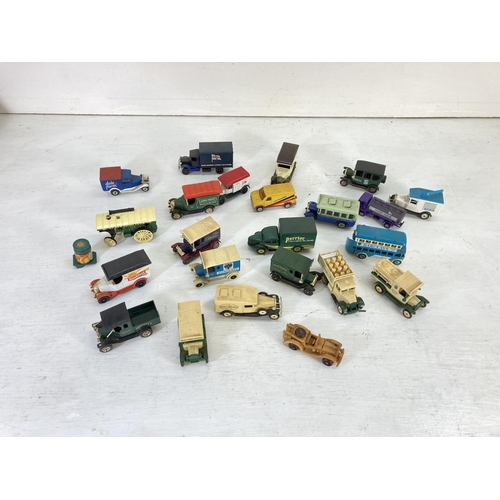 83 - A collection of assorted vintage diecast model vehicles to include Lledo Models of Days Gone, Oxford... 