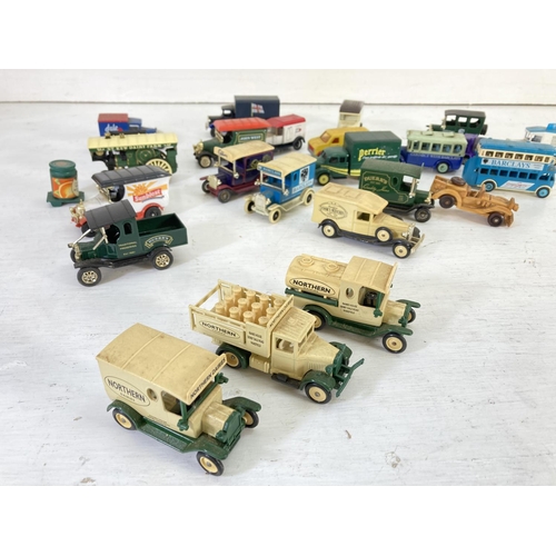 83 - A collection of assorted vintage diecast model vehicles to include Lledo Models of Days Gone, Oxford... 