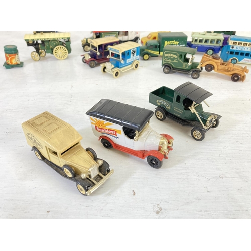 83 - A collection of assorted vintage diecast model vehicles to include Lledo Models of Days Gone, Oxford... 