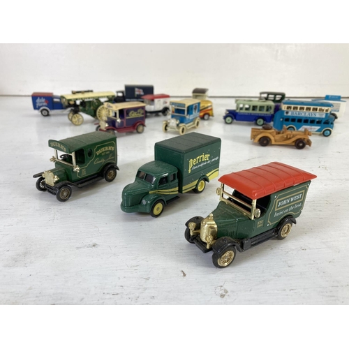 83 - A collection of assorted vintage diecast model vehicles to include Lledo Models of Days Gone, Oxford... 