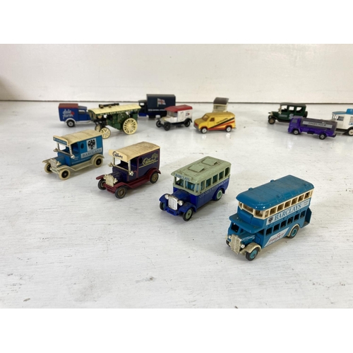 83 - A collection of assorted vintage diecast model vehicles to include Lledo Models of Days Gone, Oxford... 