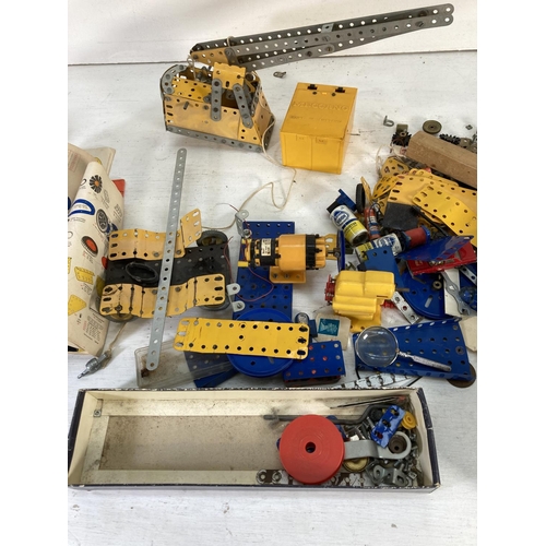 84 - A collection of vintage Meccano building accessories with various instruction manuals