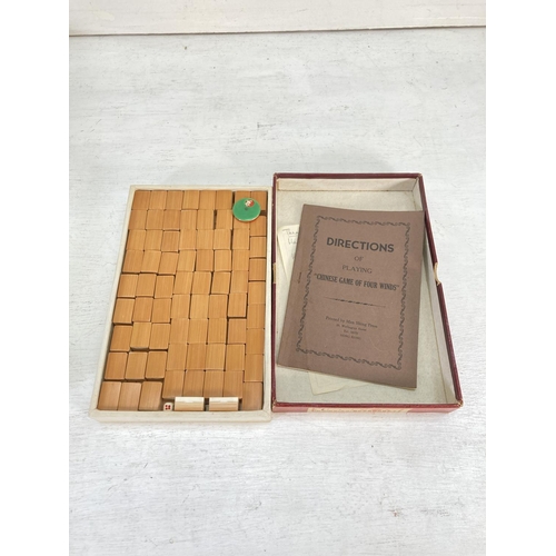 96 - Two vintage board games, one boxed Man Shing Press Chinese Game of Four Winds and one thirty piece d... 