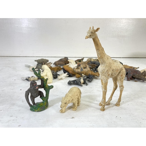 97 - A collection of vintage animal toy figurines to include hand painted lead, Britains Ltd etc.