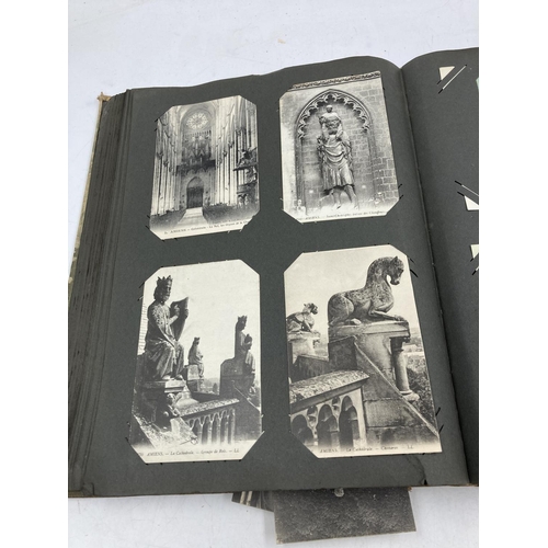 153 - An early/mid 20th century postcard album containing various vintage and antique postcards to include... 