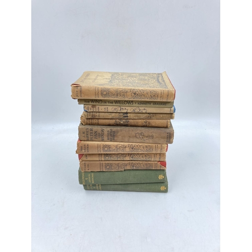 160 - Eleven various antique and vintage books to include The Wind in The Willows circa 1938, four Rudyard... 