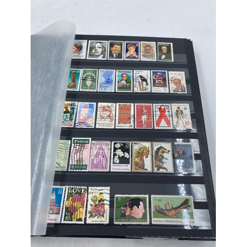 165 - A stamp album containing a collection of various world wide stamps