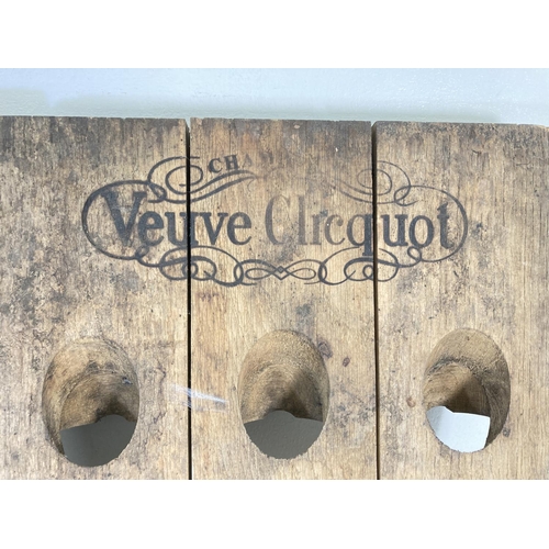 176 - A pair of vintage oak Veuve Clicquot 9 section wall mountable Champagne bottle racks - approx. 59.5c... 