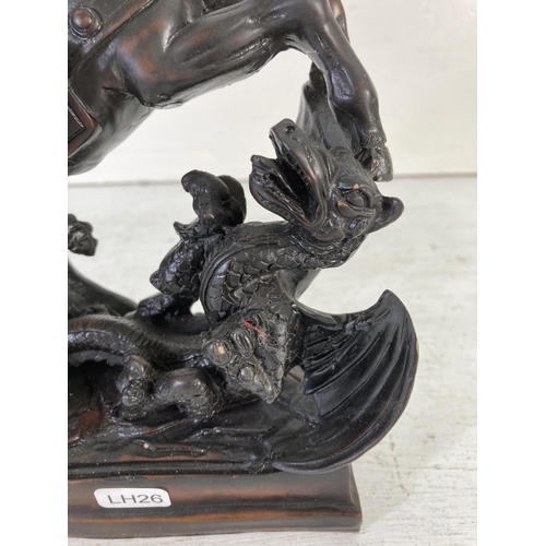 178 - A St George The Dragon Slayer resin figurine - approx. 26cm high