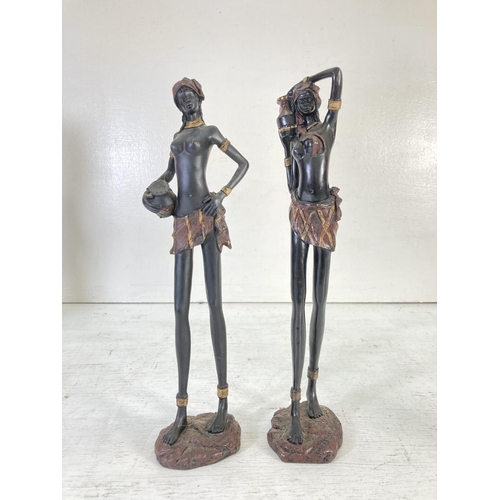 179 - Five resin and wooden African tribal figurines - tallest approx. 36cm high