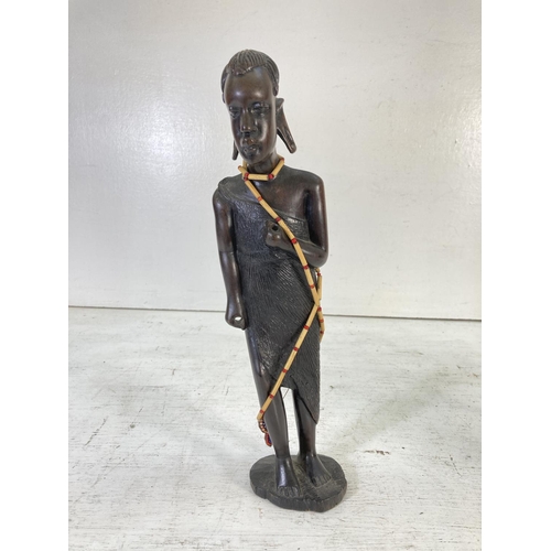 179 - Five resin and wooden African tribal figurines - tallest approx. 36cm high