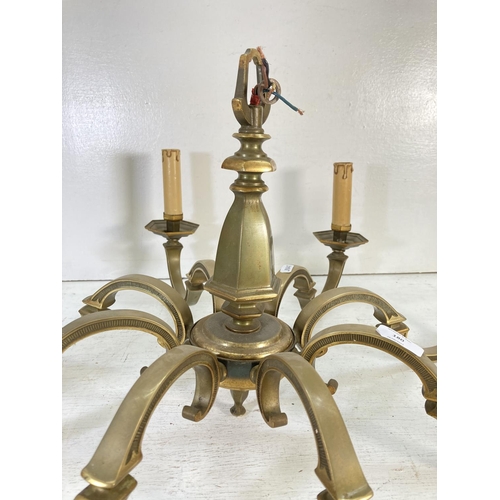 180 - A Victorian style brass eight section electric converted chandelier - approx. 34cm high x 74cm diame... 