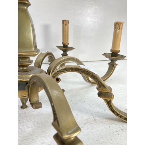 180 - A Victorian style brass eight section electric converted chandelier - approx. 34cm high x 74cm diame... 