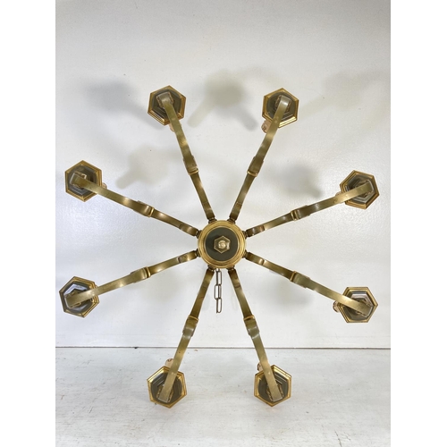 180 - A Victorian style brass eight section electric converted chandelier - approx. 34cm high x 74cm diame... 