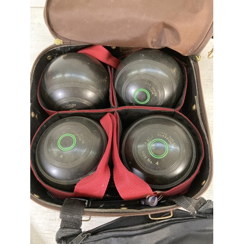 181 - A cased set of four Thomas Taylor size 4 crown green bowls together with a pair of Thomas Taylor T78... 