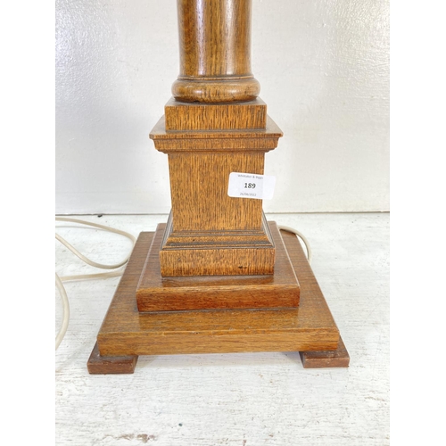 189 - A 19th century style oak table lamp - approx. 81cm high with mounting