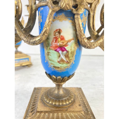 195 - A pair of Sevres style gilt metal and hand painted porcelain three branch candelabras - approx. 32cm... 