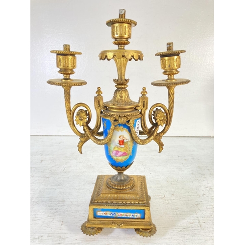 195 - A pair of Sevres style gilt metal and hand painted porcelain three branch candelabras - approx. 32cm... 