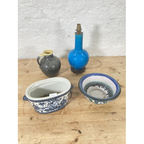 59A - Four pieces of various ceramics to include Seviers studio pottery jug, Oriental table lamp etc.