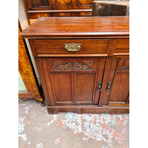 422 - An Edwardian mahogany sideboard with two drawers and two carved panel doors - approx. 93cm high x 12... 