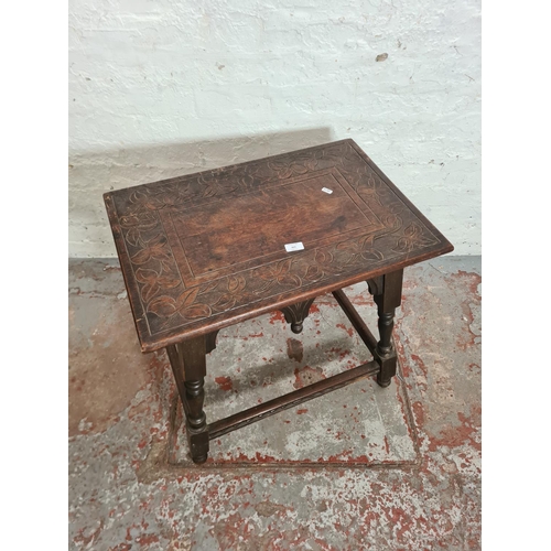 425 - A 19th century carved oak rectangular joint side table with leaf design - approx. 65cm high x 66cm w... 