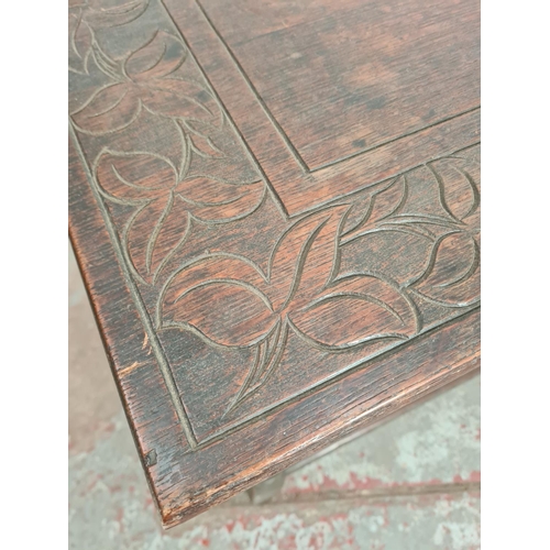 425 - A 19th century carved oak rectangular joint side table with leaf design - approx. 65cm high x 66cm w... 