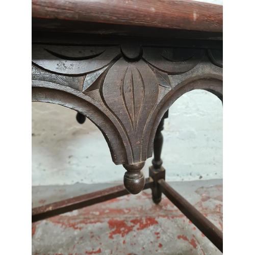 425 - A 19th century carved oak rectangular joint side table with leaf design - approx. 65cm high x 66cm w... 