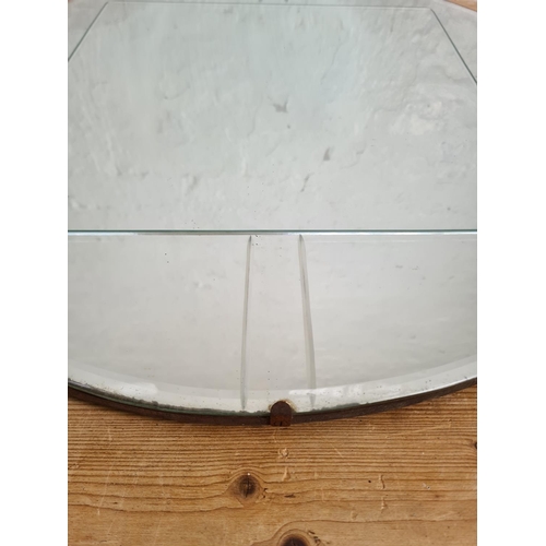 488 - A mid 20th century frameless bevelled edge circular wall mirror - approx. 61cm in diameter