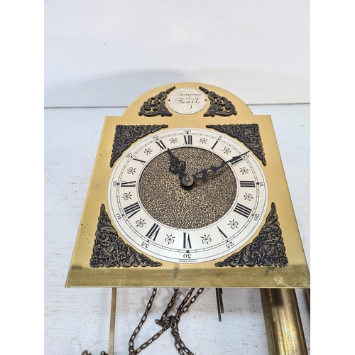 197 - An E. Schmeckeneecher of West Germany brass Tempus Fugit clock face with pendulum and two weights - ... 