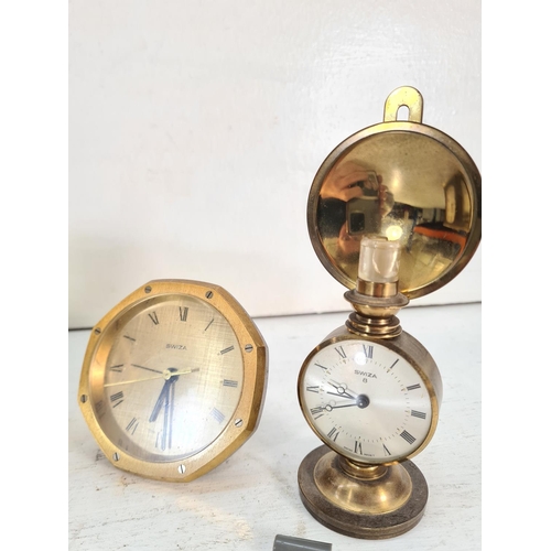 199 - Four various brass clocks, three Swiza and one Angelus