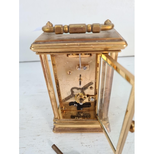 201 - A St. James brass and bevelled glass cased key wind carriage clock - approx. 13cm high x 8cm wide x ... 