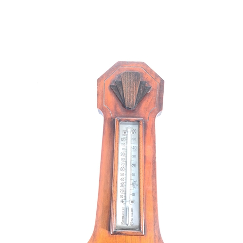 202 - An Art Deco walnut cased barometer with white metal presentation plaque inscribed 'Presented to Mr. ... 