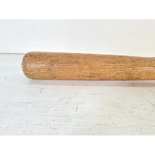 209 - A vintage oak baseball bat - approx. 83cm long