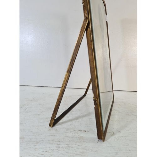 218 - An early 20th century brass and bevelled glass photo frame - approx. 37.5cm high x 27.5cm wide