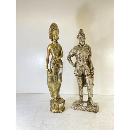 231 - Two plaster figurines, one conquistador - approx. 66cm high and one lady - approx. 69cm high