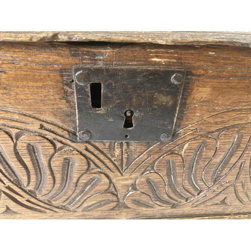 233 - A 17th century carved oak Bible box - approx. 17cm high x 42cm wide x 33cm deep