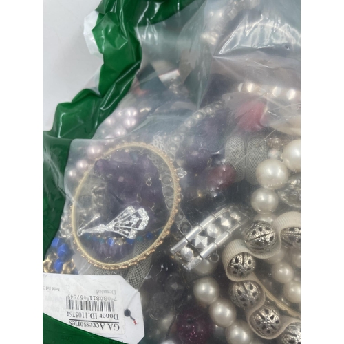 127 - Approx. 10kg of costume jewellery to include bangles, necklaces, rings, earrings etc.