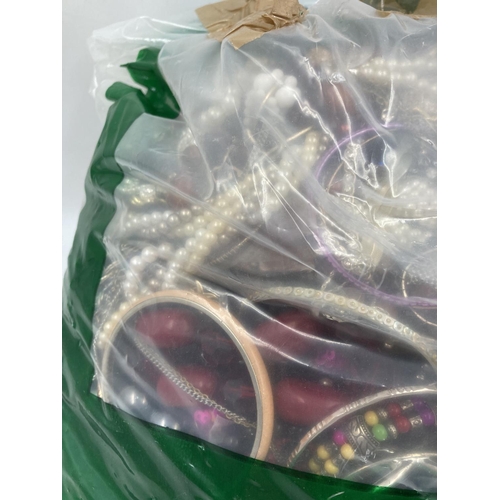 135 - Approx. 10kg of costume jewellery to include bangles, necklaces, rings, earrings etc.