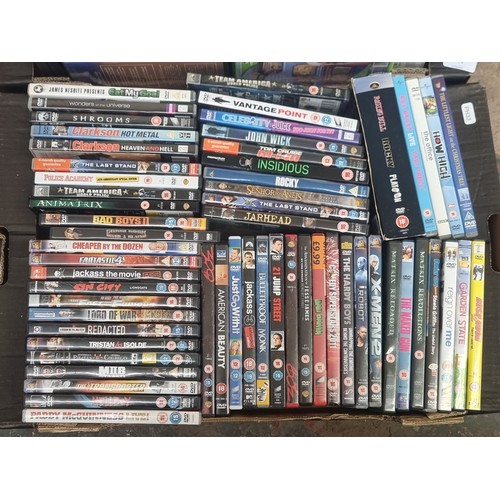 594 - Two boxes containing a collection of DVDs - see images for titles