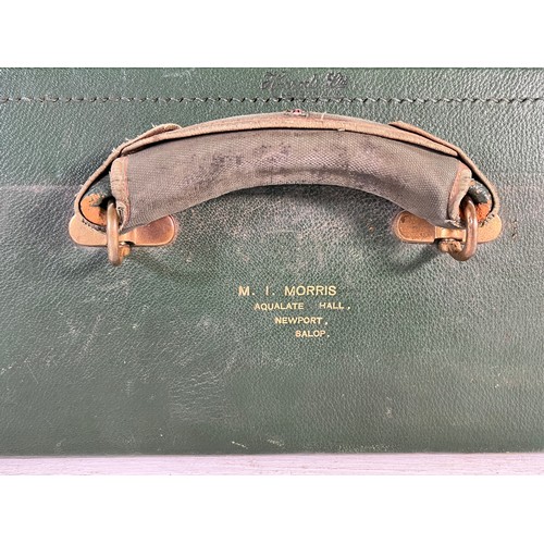 1240 - An M.I. Morris of Newport green leather travel case containing William Comyns & Sons Ltd hallmarked ... 