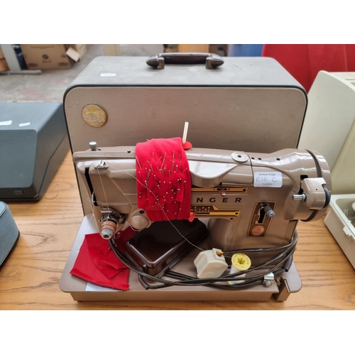 616C - A cased Singer 328K electric sewing machine with foot pedal