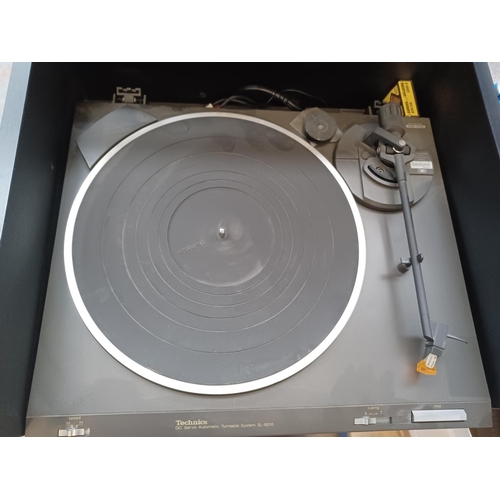 556 - A hi-fi cabinet containing five items of Technics hi-fi comprising SL-B210 two speed turntable, ST-Z... 