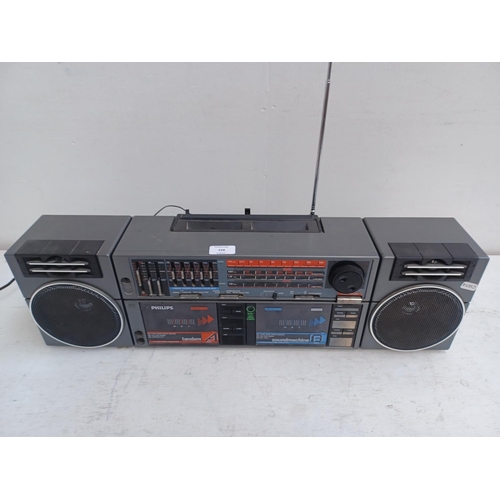 558 - A Philips portable four band radio/twin cassette with detachable speakers